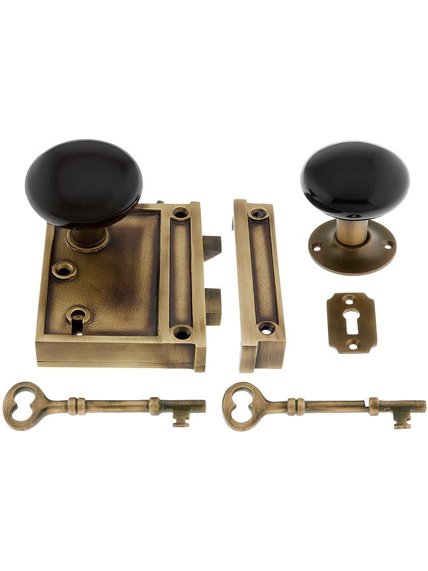 Solid Brass Vertical Rim Lock Set with Black Porcelain Door Knobs.